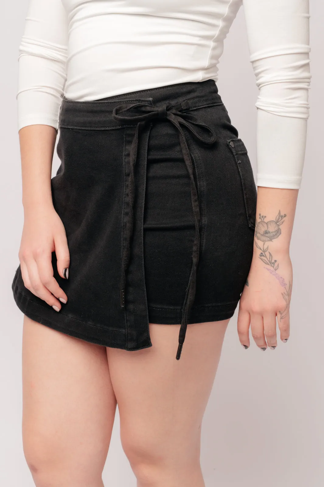 Bentli High Rise Side Tie Denim Skort in Black